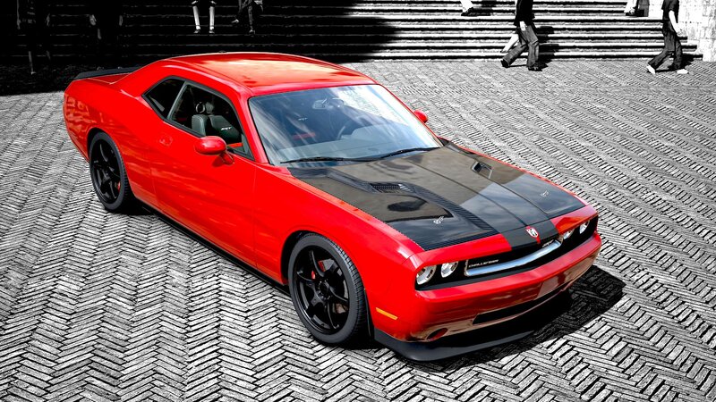 Red Dodge Challenger on cobblestones
