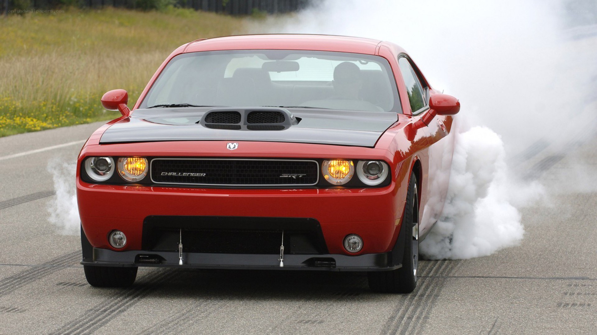 Red Dodge Challenger SRT burnout