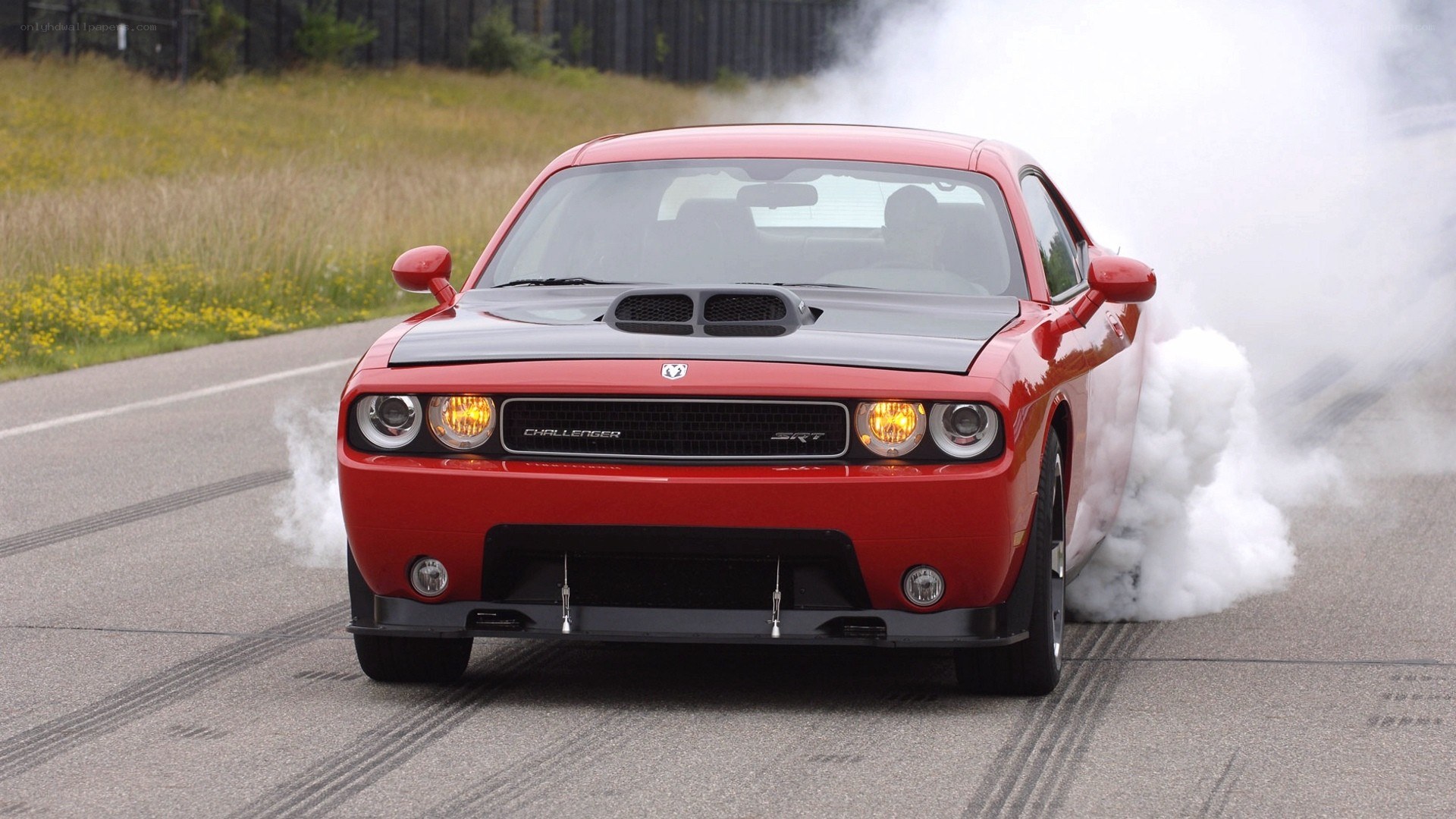 Red Dodge Challenger SRT burnout