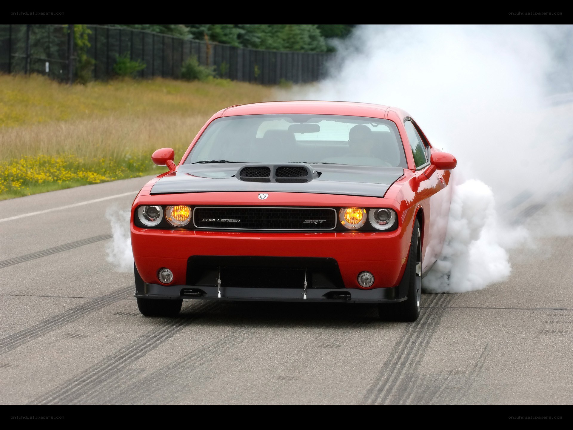 Red Dodge Challenger SRT burnout