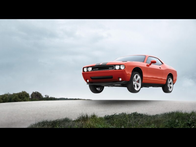 Red Dodge Challenger SRT in mid-air