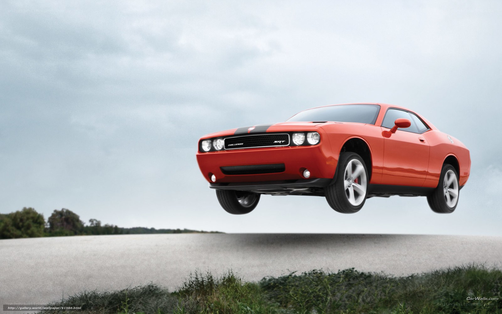 Red Dodge Challenger SRT in mid-air