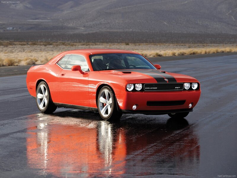 Red Dodge Challenger SRT on wet road
