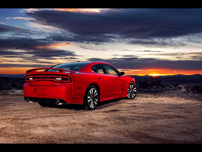 Red Dodge Charger at sunset
