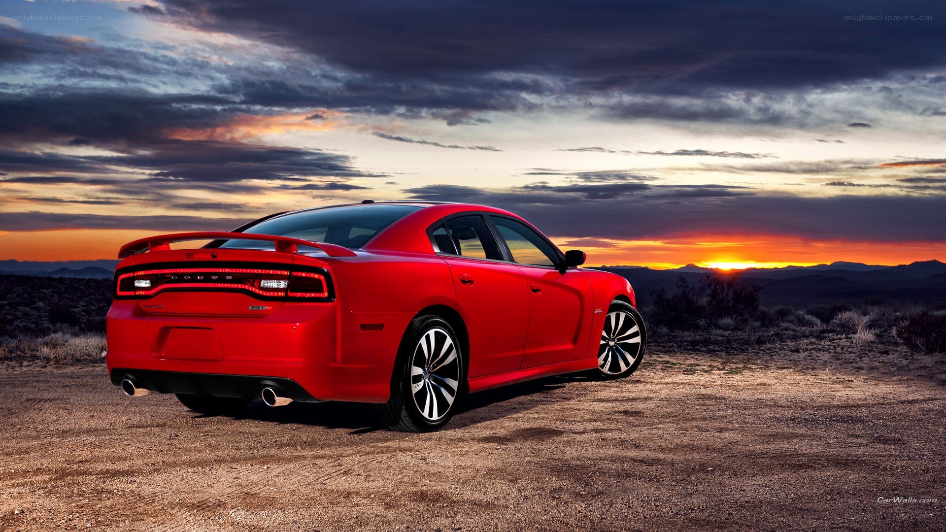Red Dodge Charger at sunset