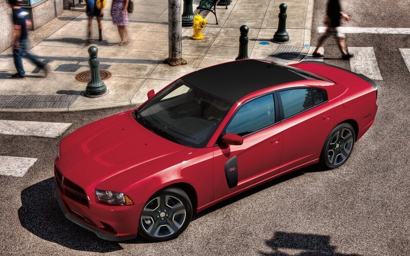 Red Dodge Charger on city street