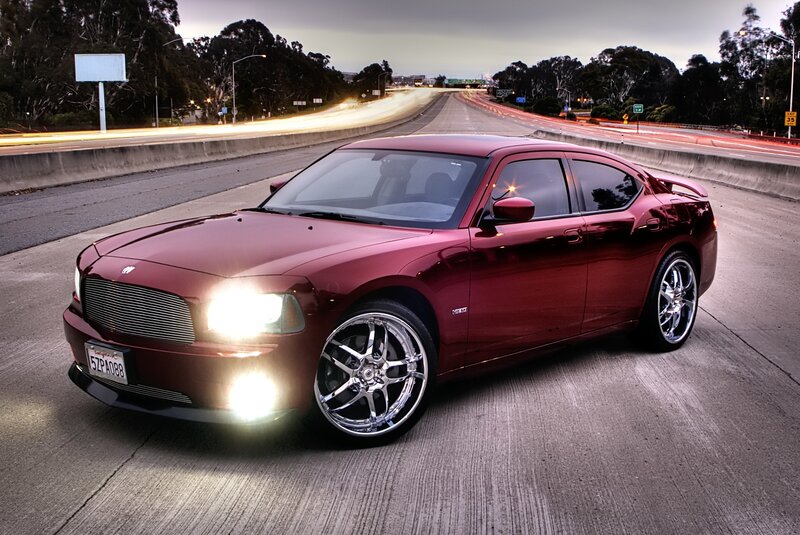 Red Dodge Charger on highway