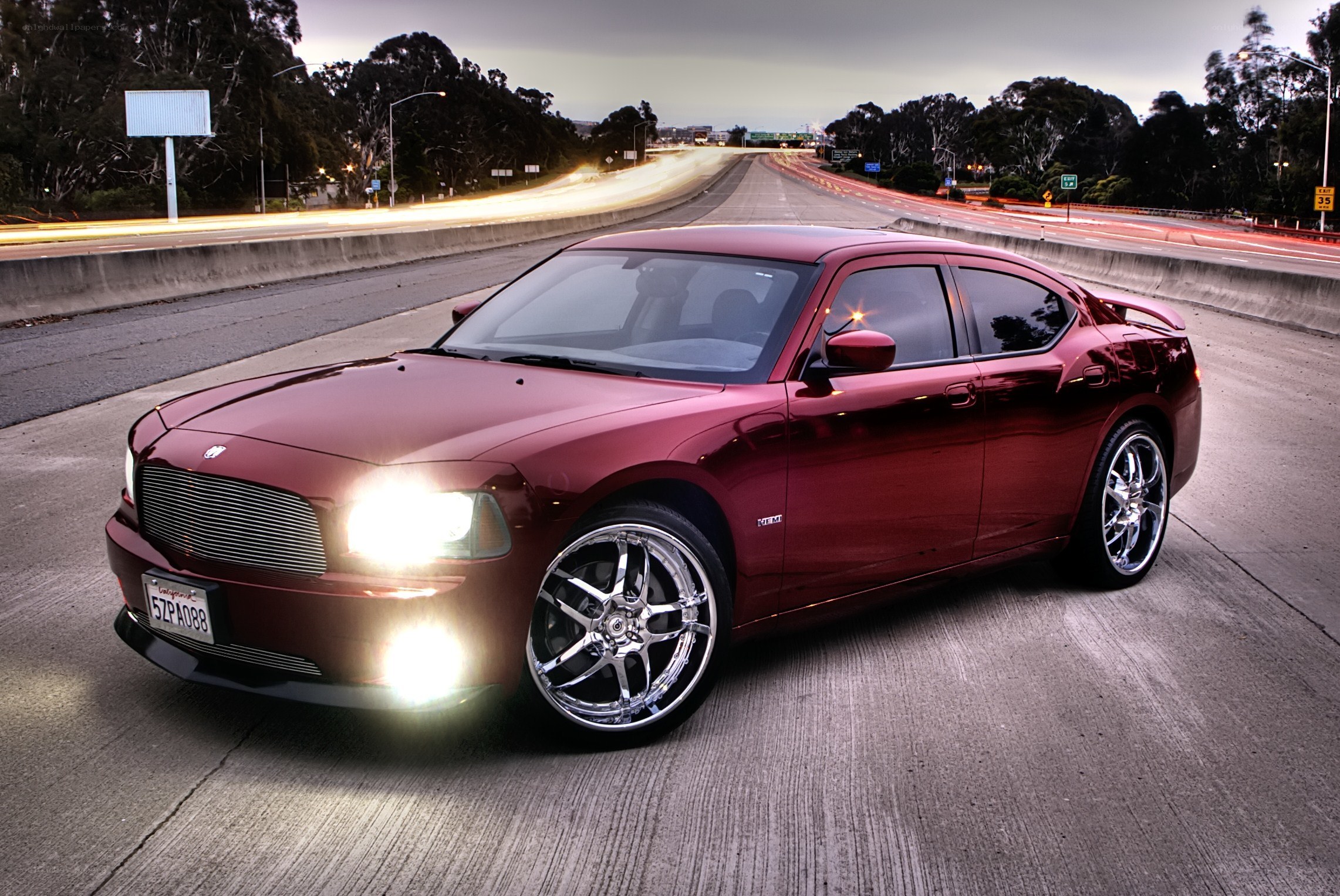 Red Dodge Charger on highway