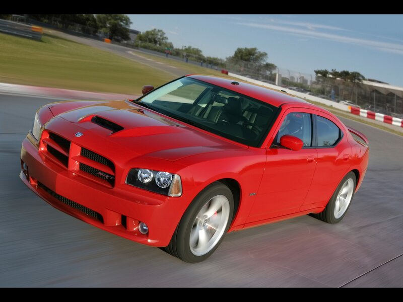 Red Dodge Charger SRT on racetrack