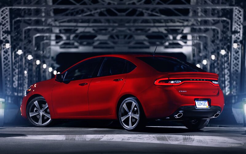 Red Dodge Dart at night