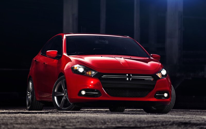 Red Dodge Dart in dark setting