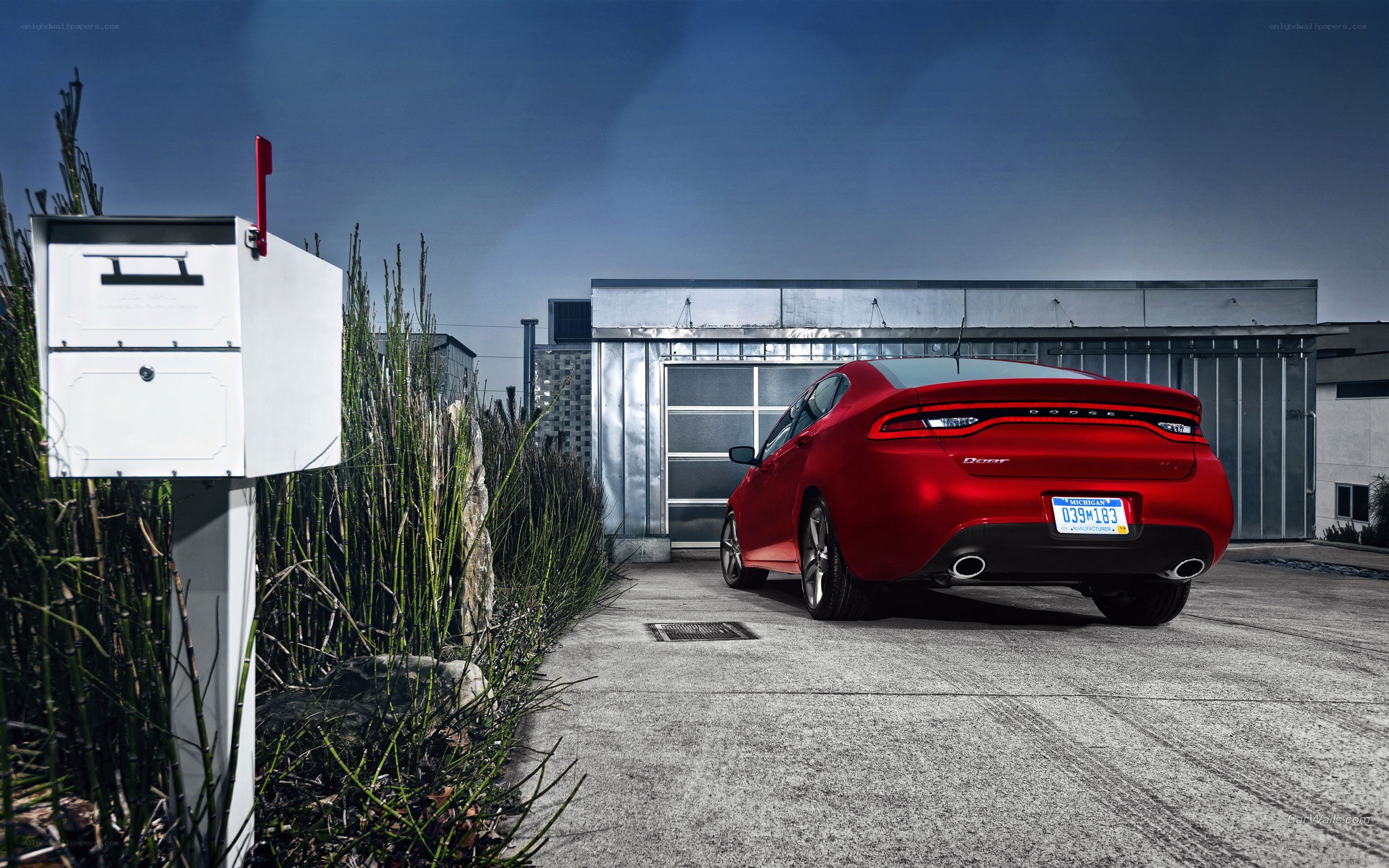 Red Dodge Dart in driveway
