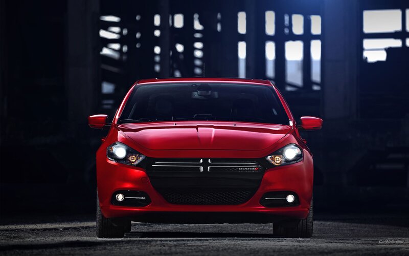 Red Dodge Dart in industrial setting