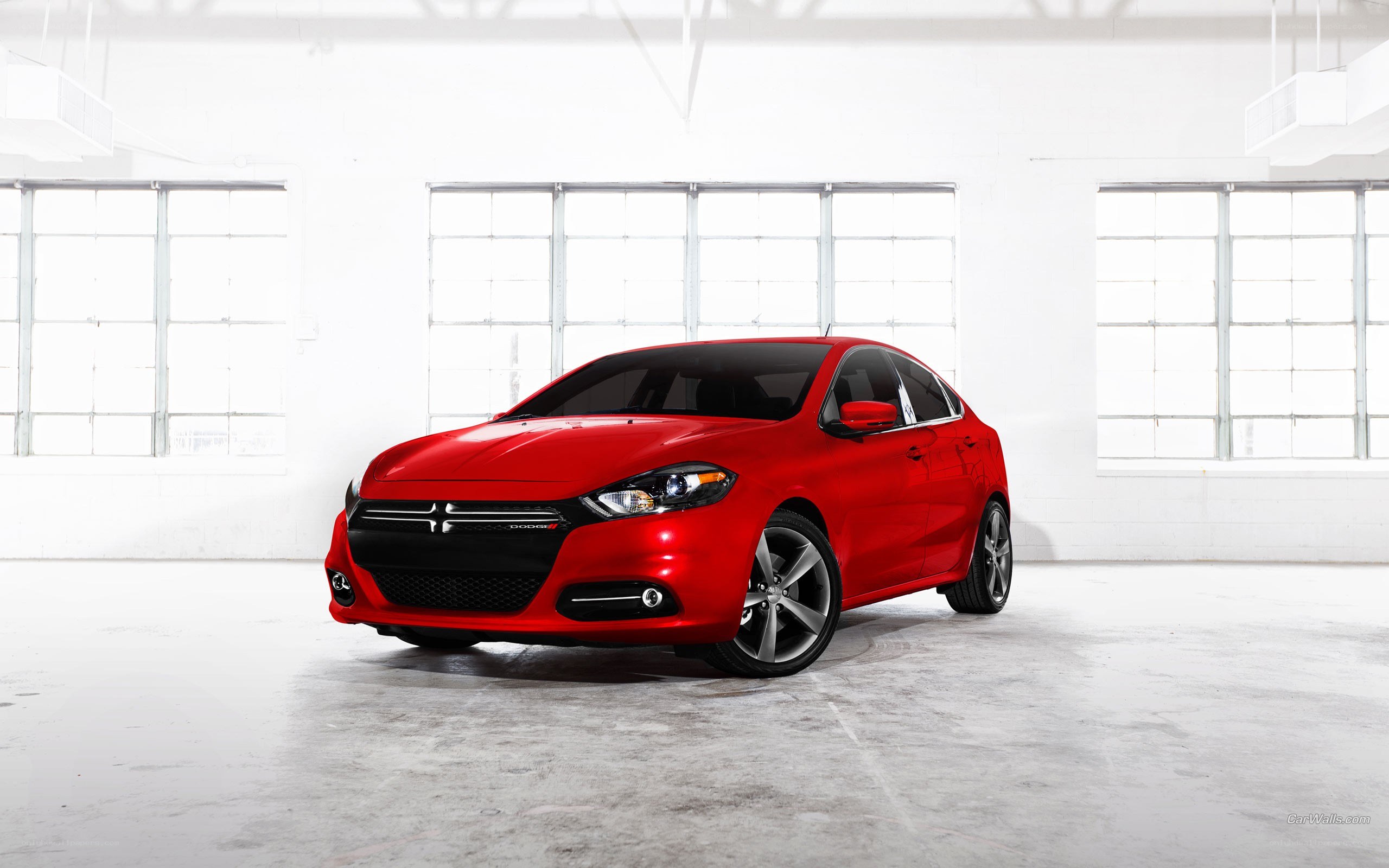 Red Dodge Dart in warehouse