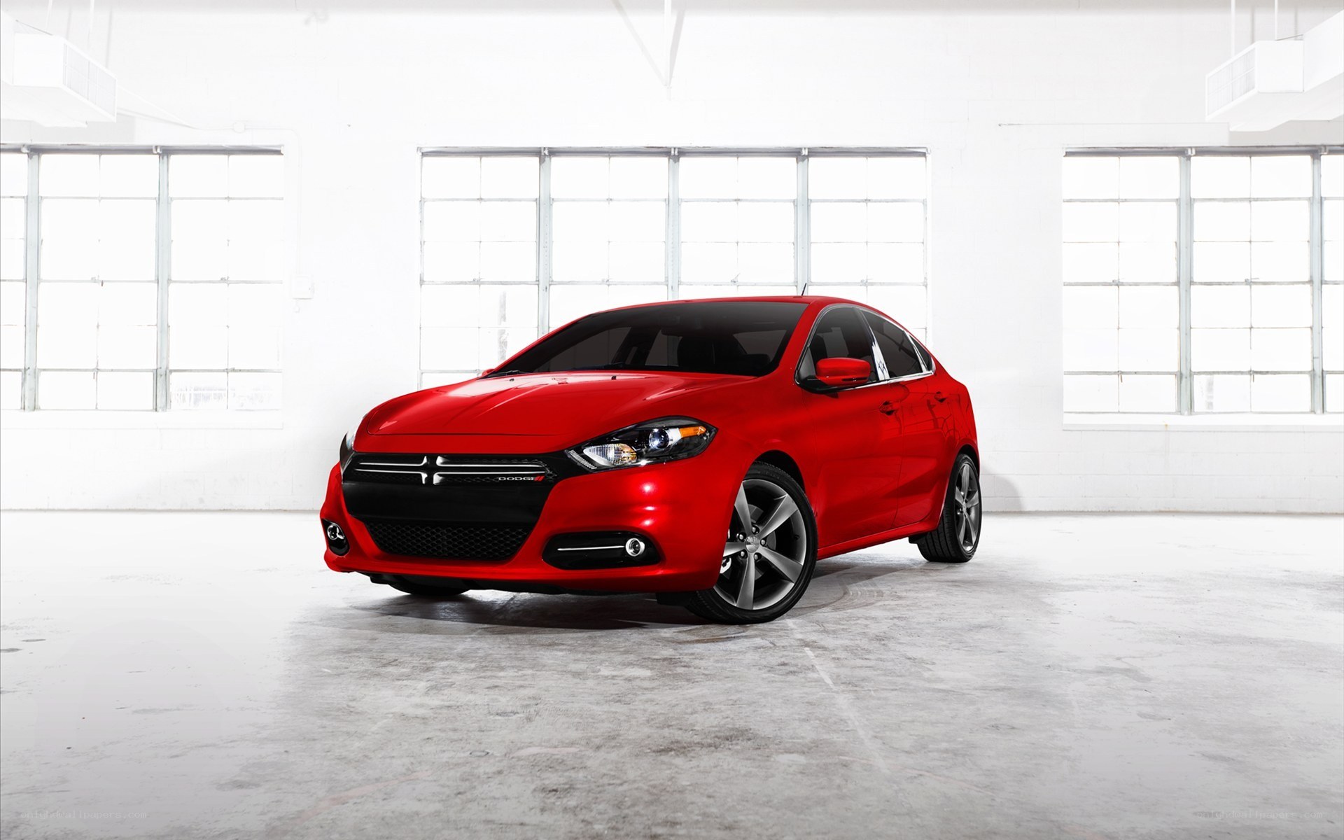 Red Dodge Dart in warehouse
