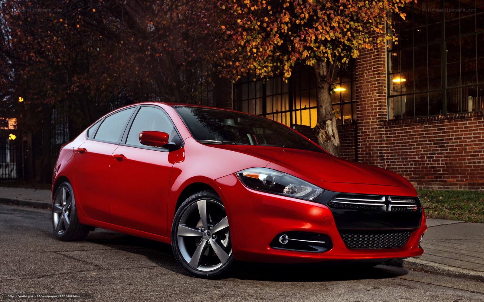Red Dodge Dart on city street