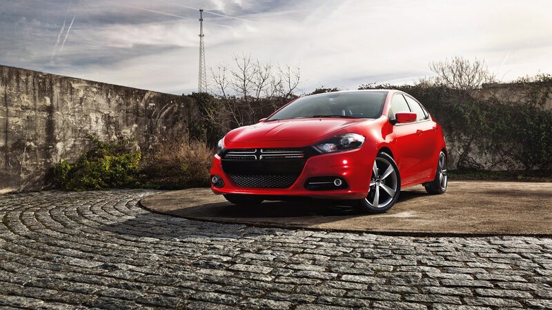 Red Dodge Dart on cobblestone