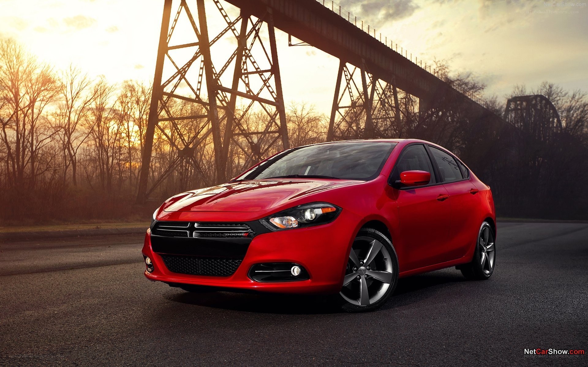 Red Dodge Dart on road