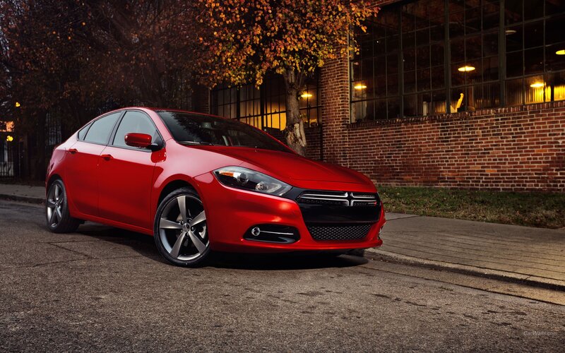 Red Dodge Dart parked on street