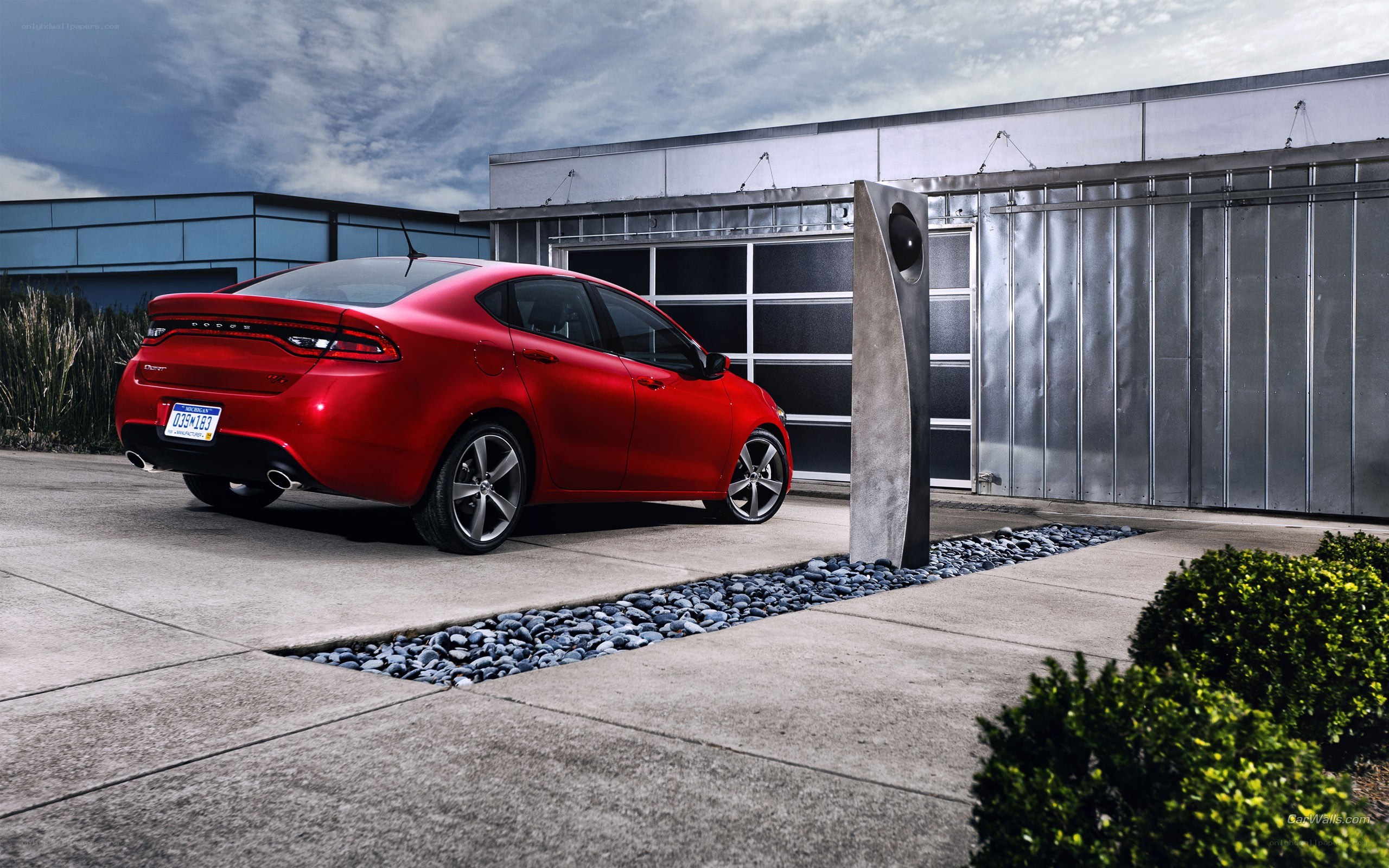 Red Dodge Dart parked outside