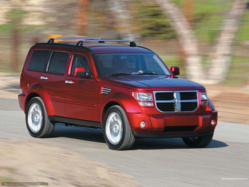 Red Dodge Nitro in motion