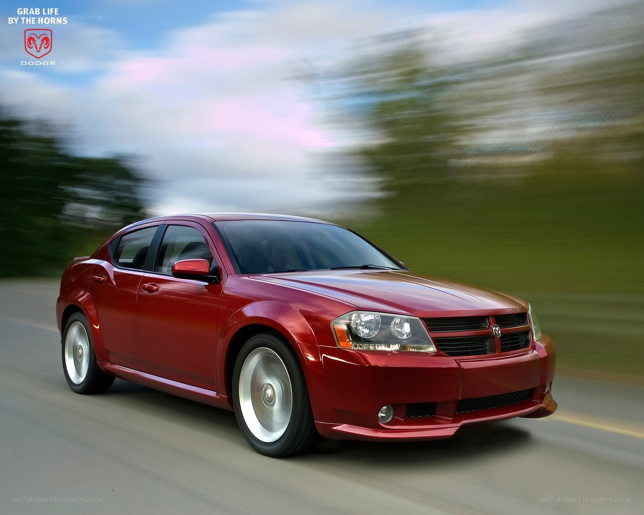 Red Dodge sedan in motion