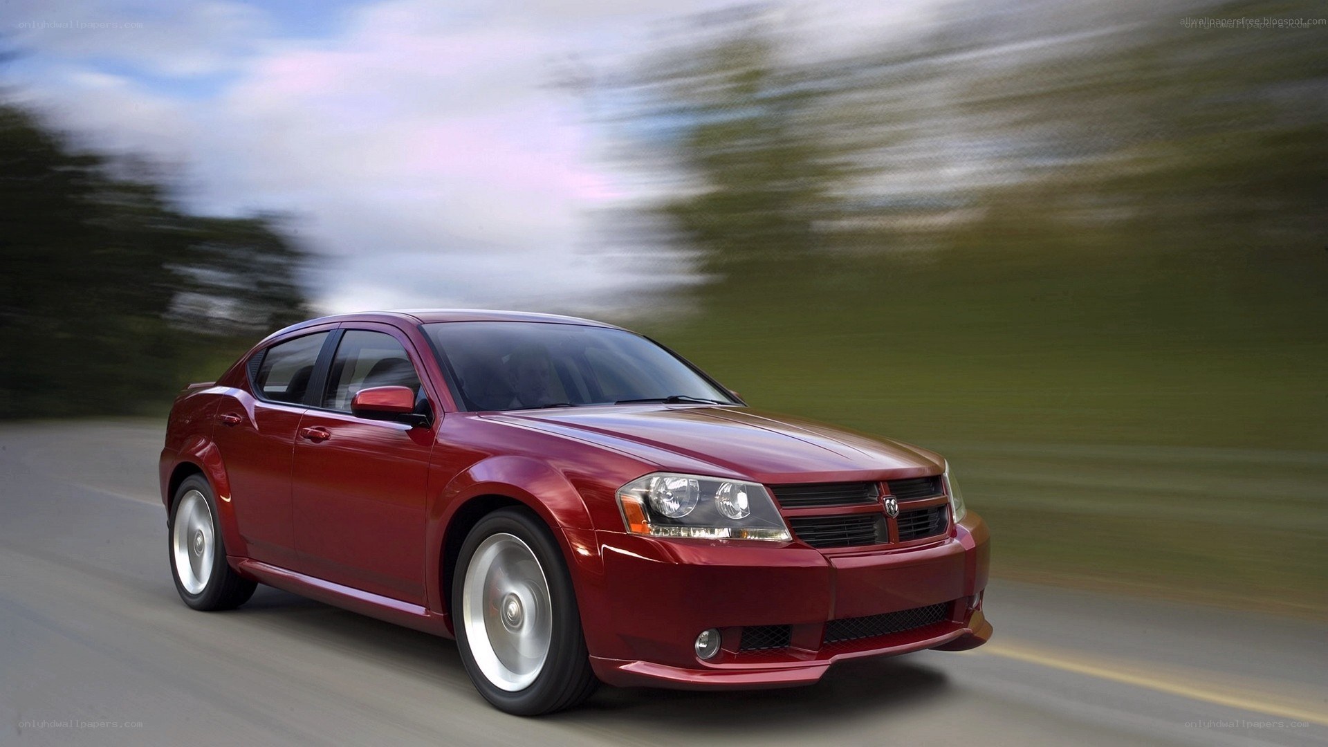 red dodge sedan in motion