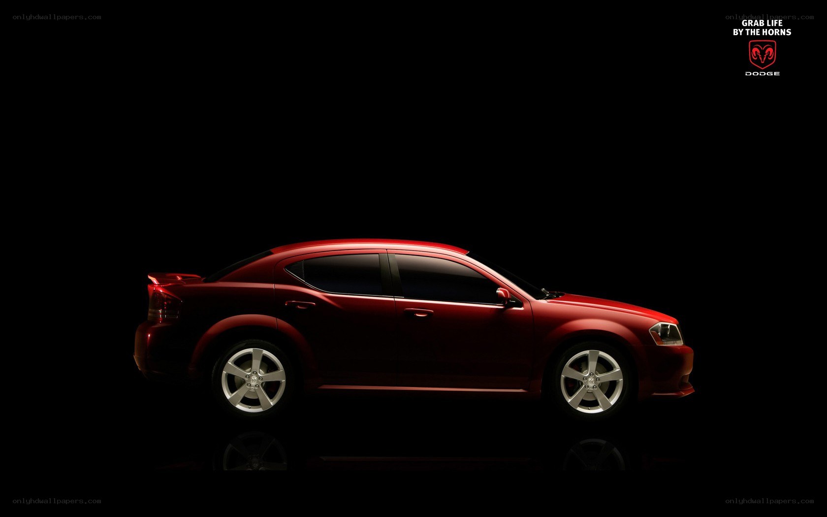 Red Dodge sedan in silhouette