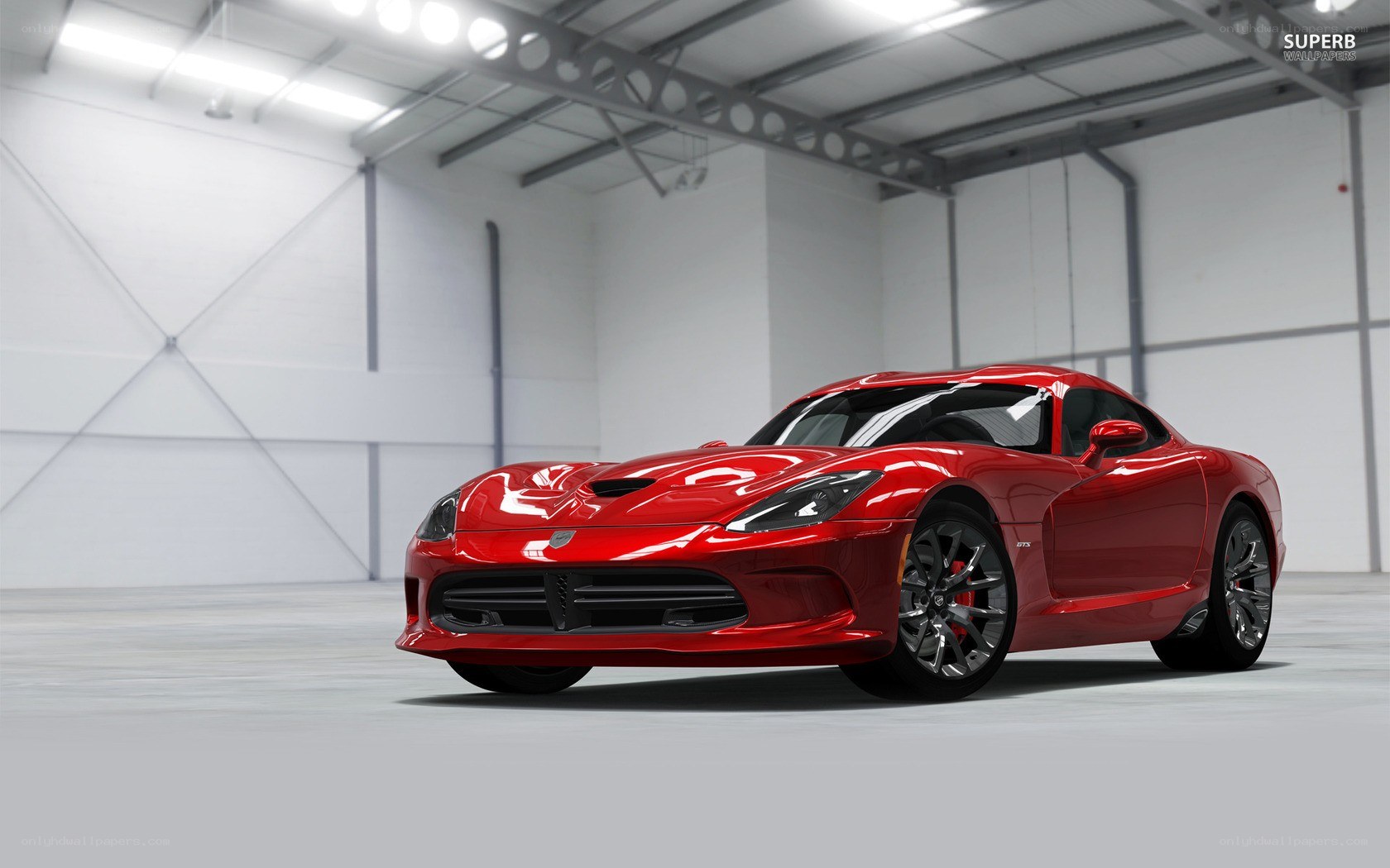 Red Dodge Viper in a warehouse