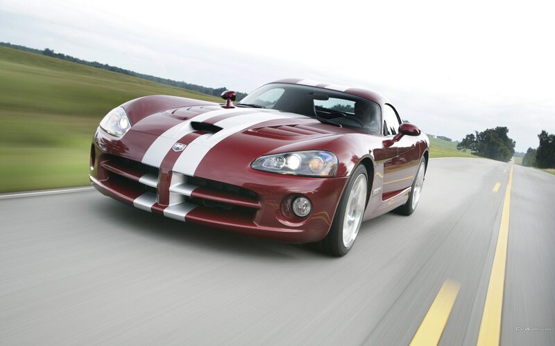 Red Dodge Viper on a country road