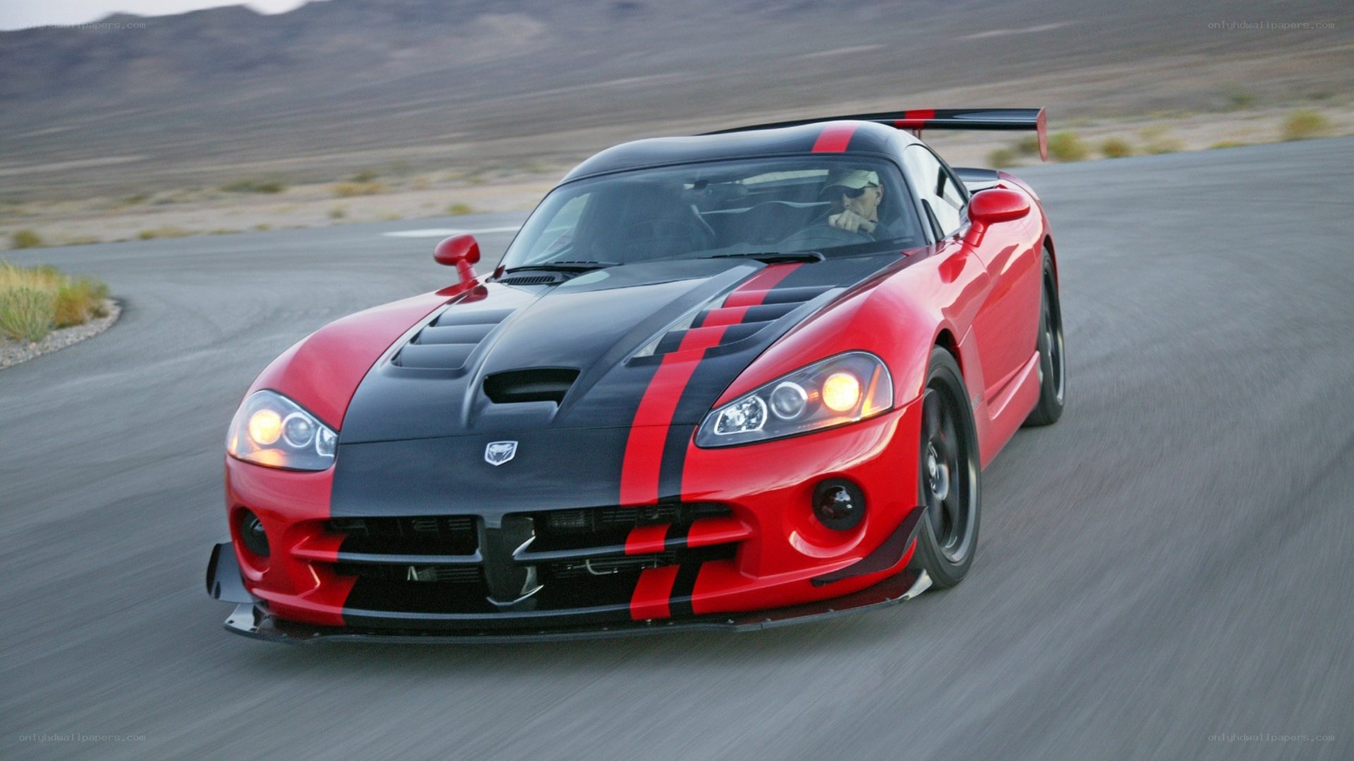 Red Dodge Viper on a desert track