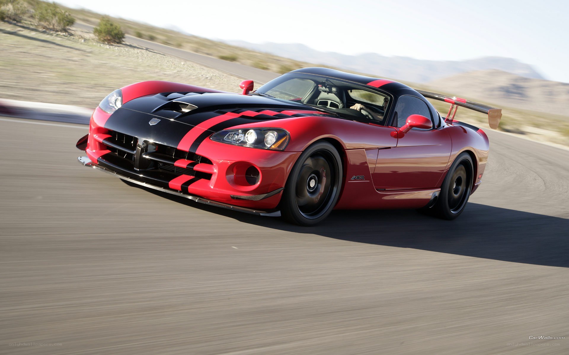 red dodge viper on a racetrack