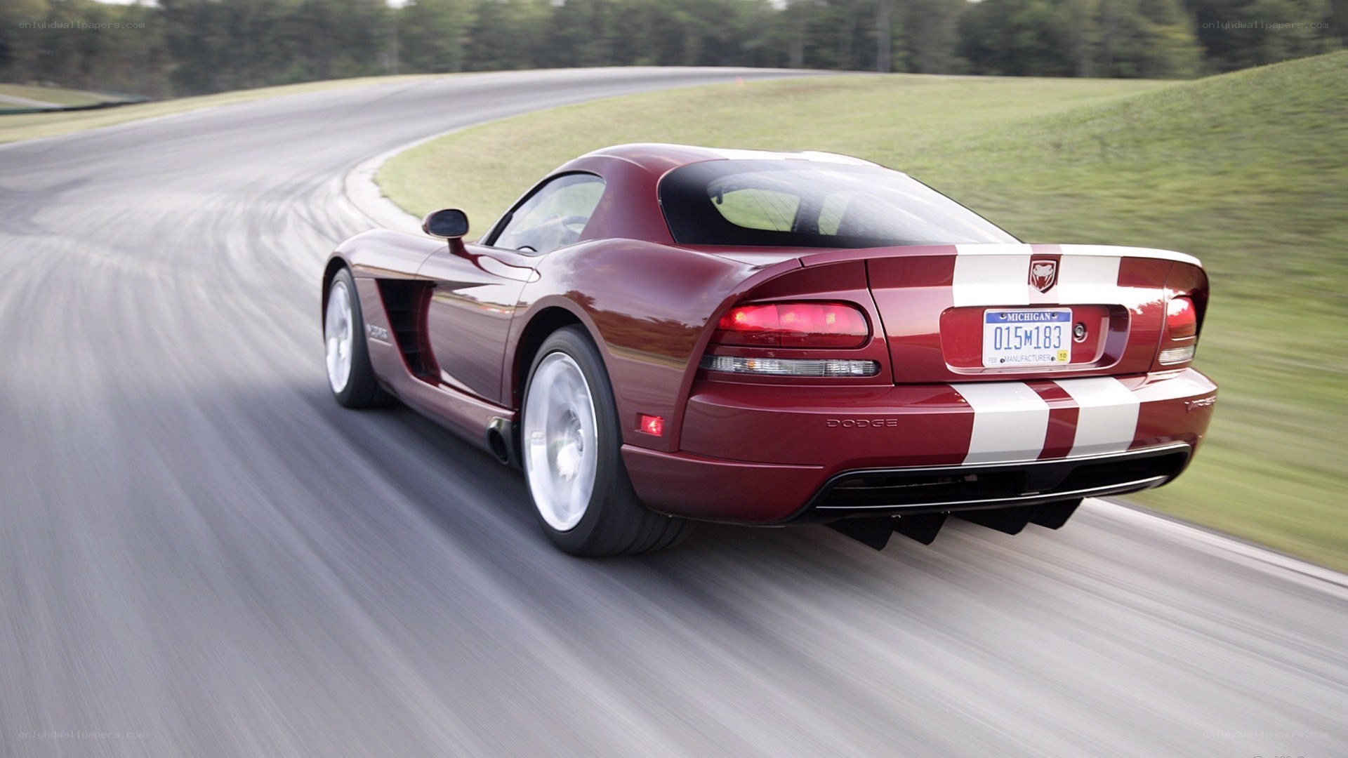 red dodge viper on a racetrack