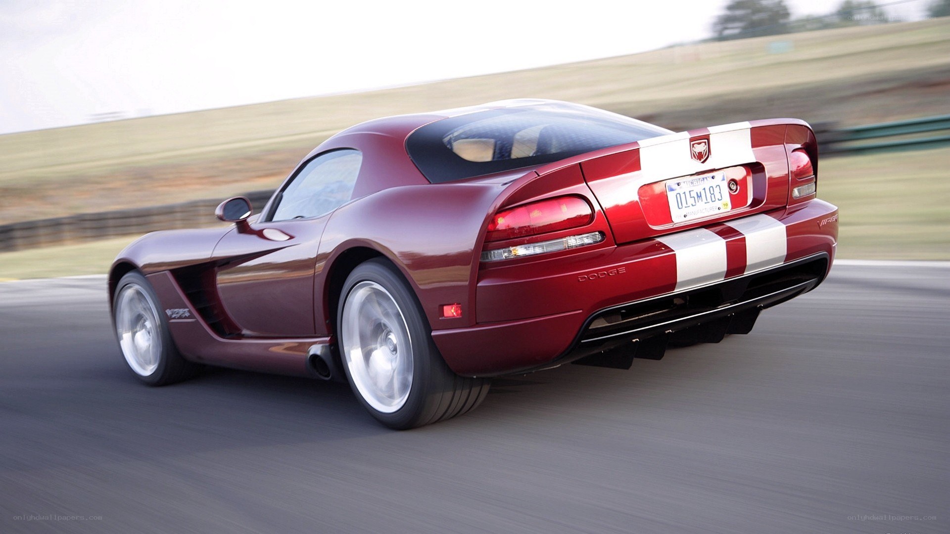 Red Dodge Viper on racetrack