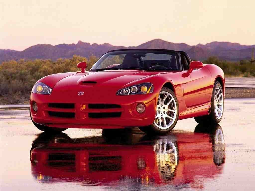 Red Dodge Viper on wet pavement