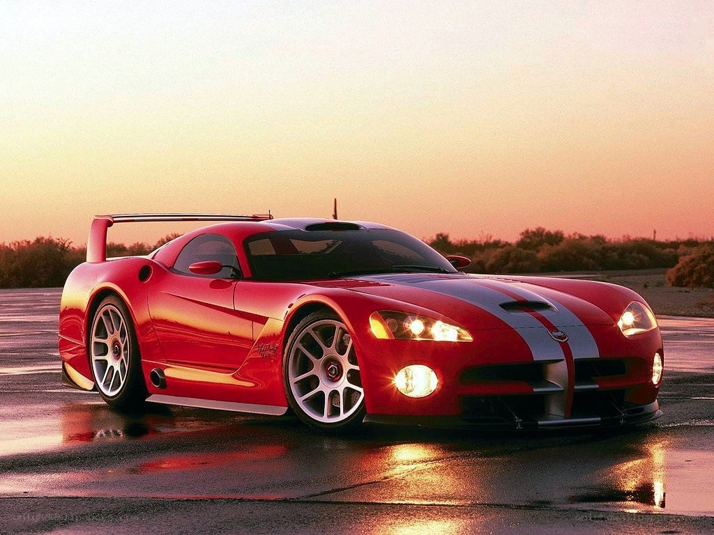 Red Dodge Viper on wet track