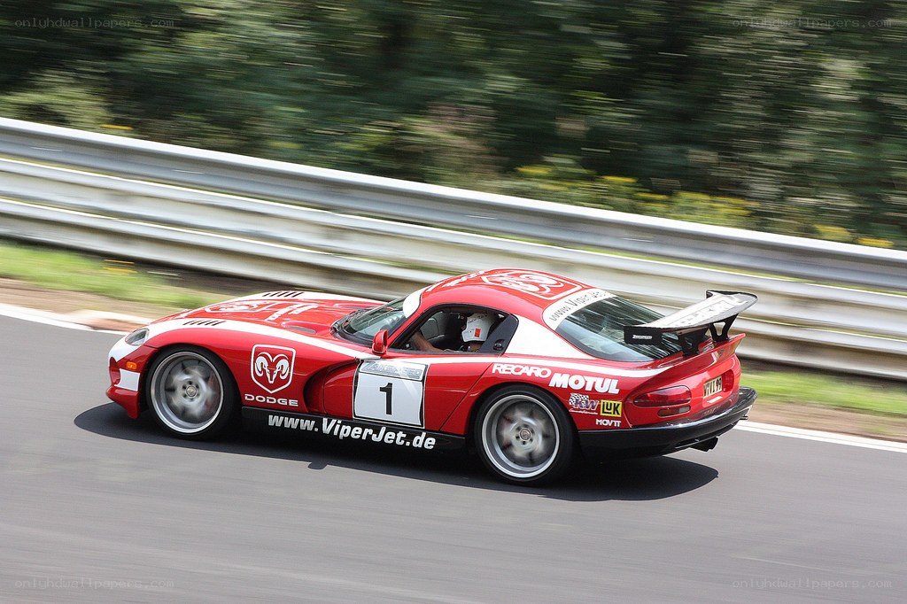 Red Dodge Viper racing on track