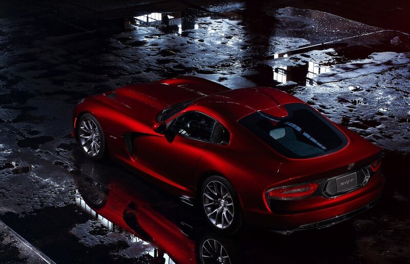 Red Dodge Viper SRT on wet pavement