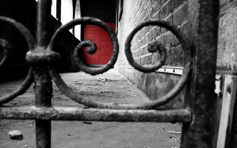 Red door in alleyway