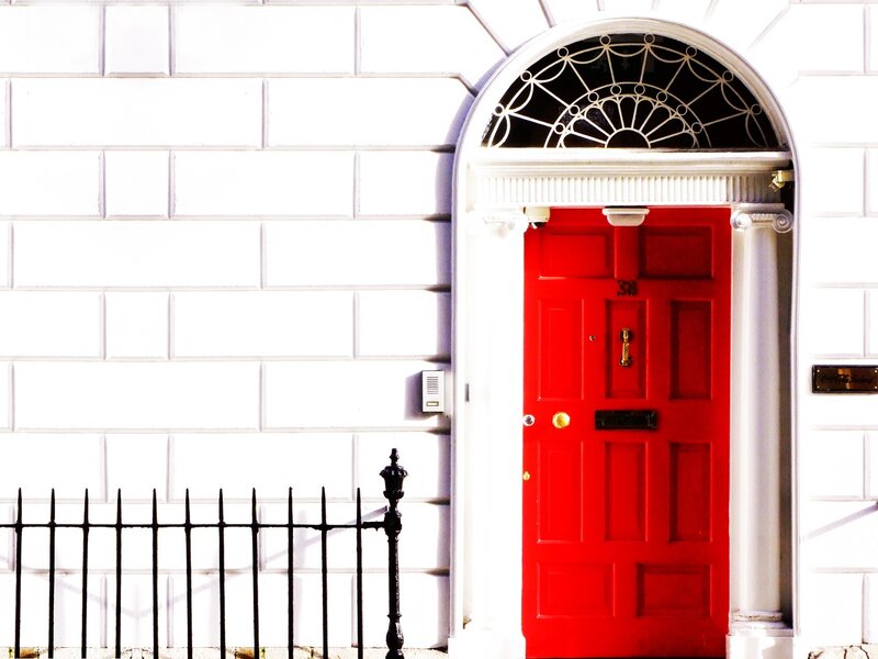 Red Door on White Wall