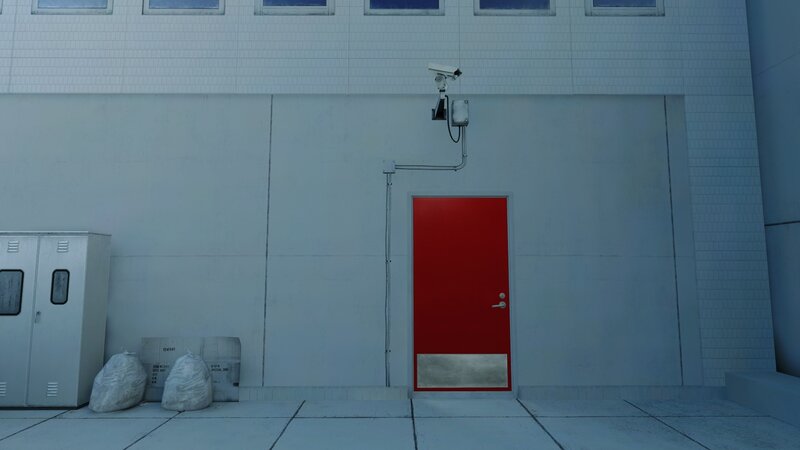 red door with security camera