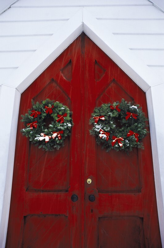 Red doors with Christmas wreaths
