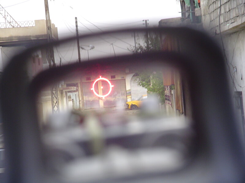 red dot sight view of street