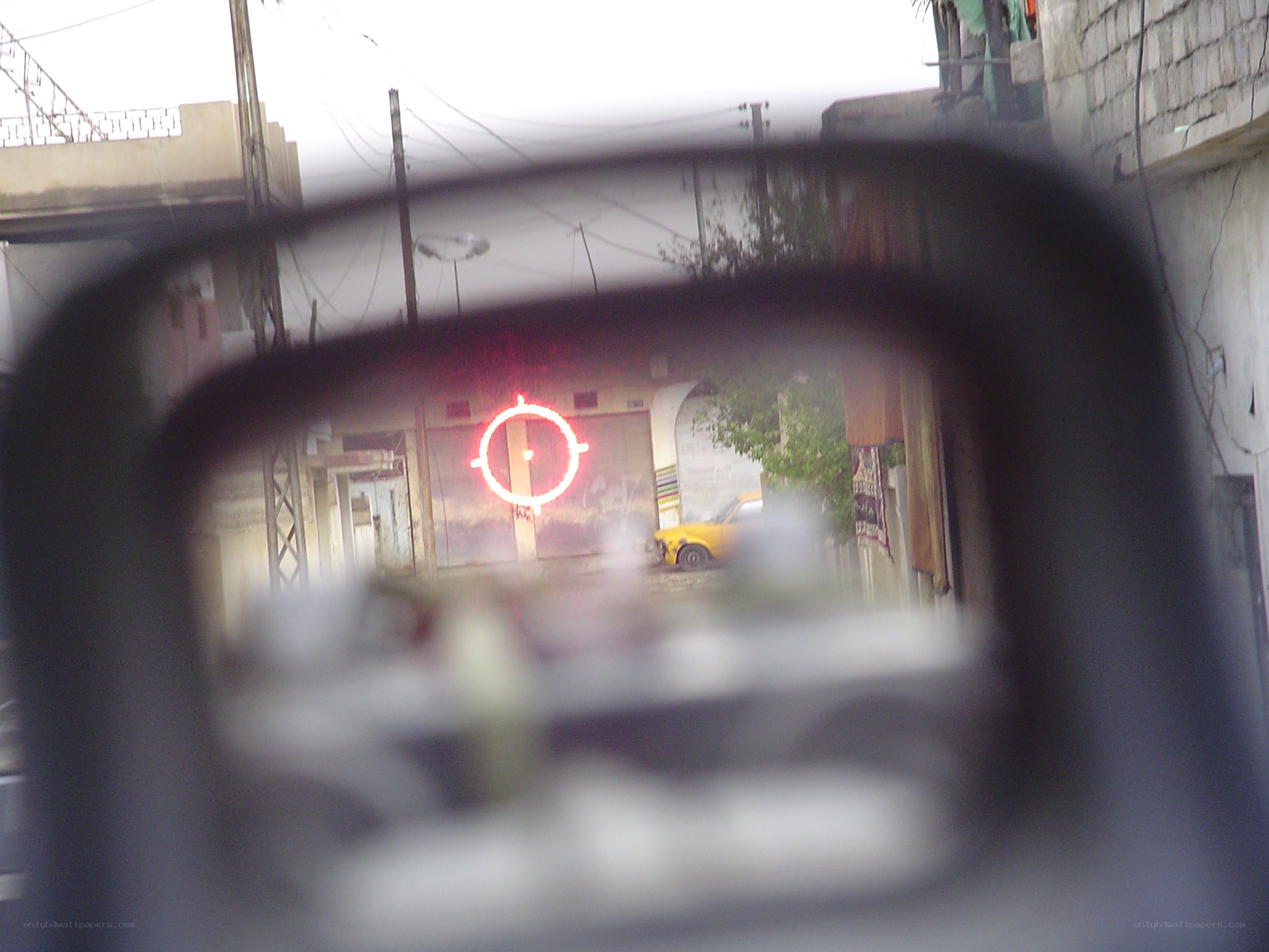 red dot sight view of street