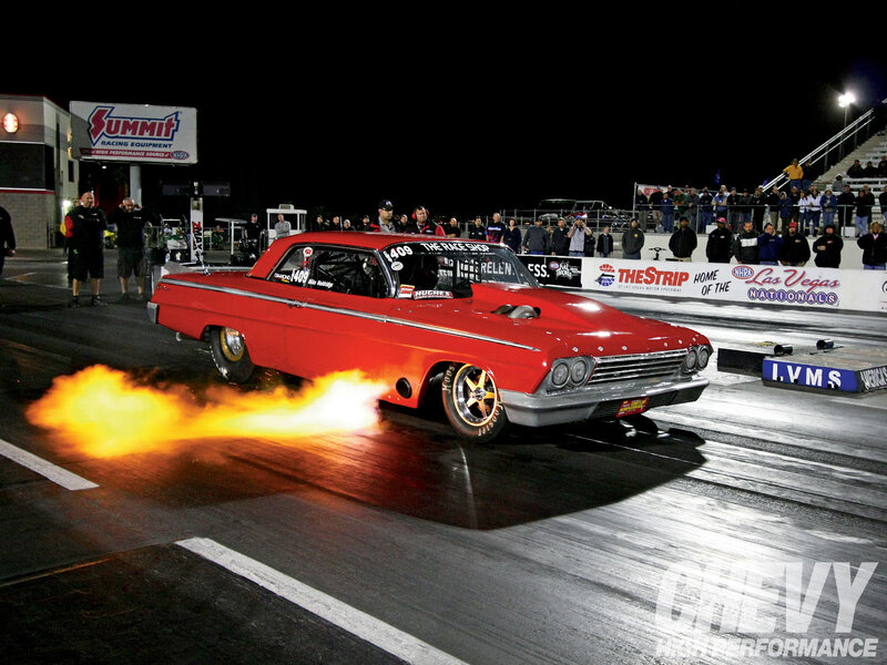 Red drag car at night