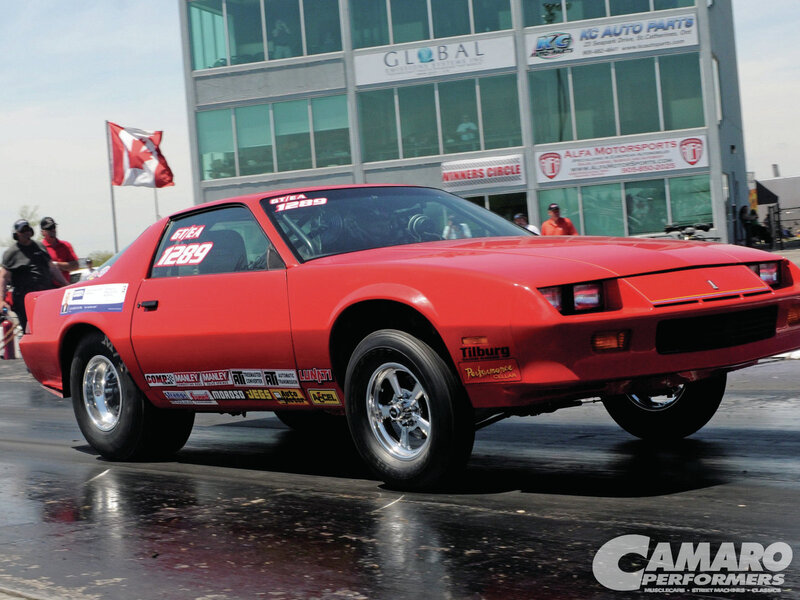 Red Drag Racing Car — Active, Afternoon, Photograph, Building