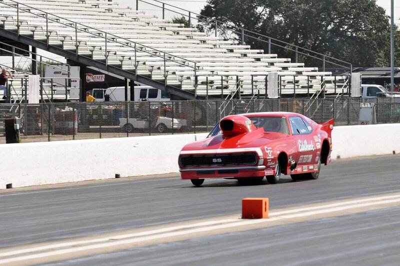 Red Drag Racing Car — Active, Afternoon, Photograph, Race Track, Bleachers