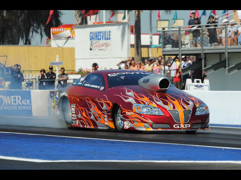 Red Drag Racing Car — Dynamic, Afternoon, Photograph, Flame Decals, Crowd