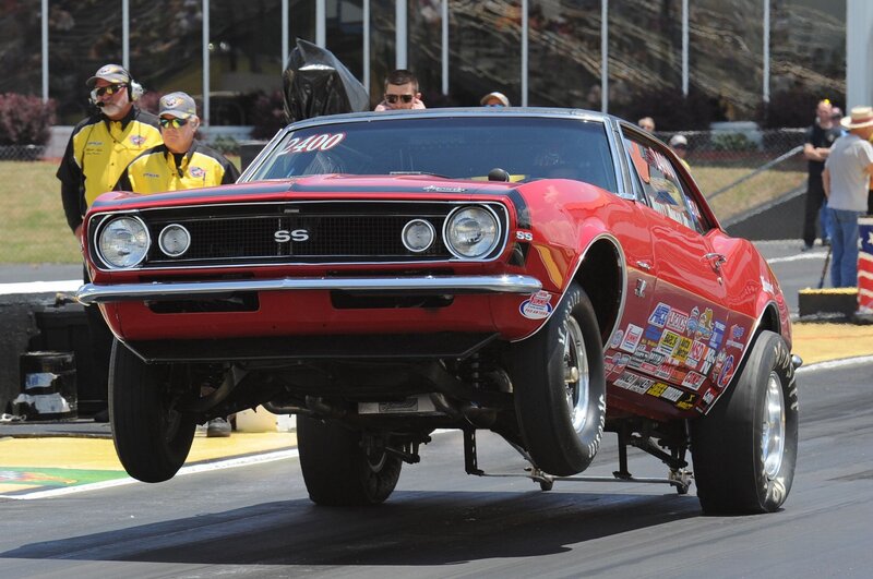 Red Drag Racing Car — Dynamic, Afternoon, Photograph, People, Race Track