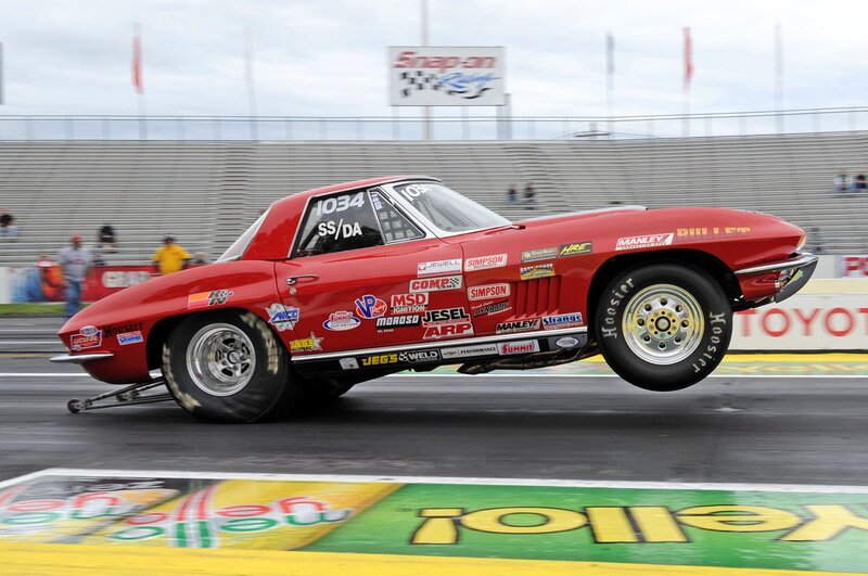 Red Drag Racing Car — Dynamic, Afternoon, Photograph, Race Track, Spectators, Stadium